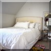 F27. Queen bed with nailhead trim. 53”h 